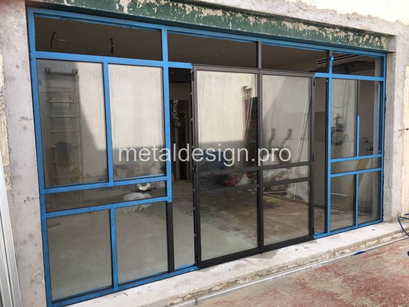 Rénovation de façade en verrière métallique