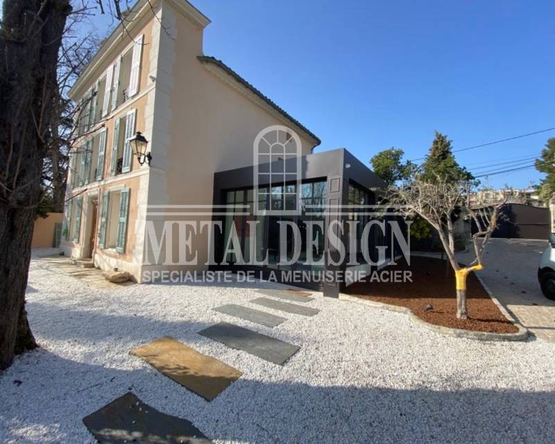 Agrandir avec une véranda en acier